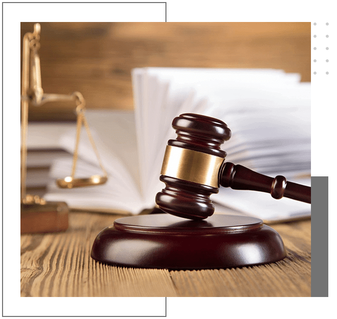 A wooden gavel sitting on top of a table.